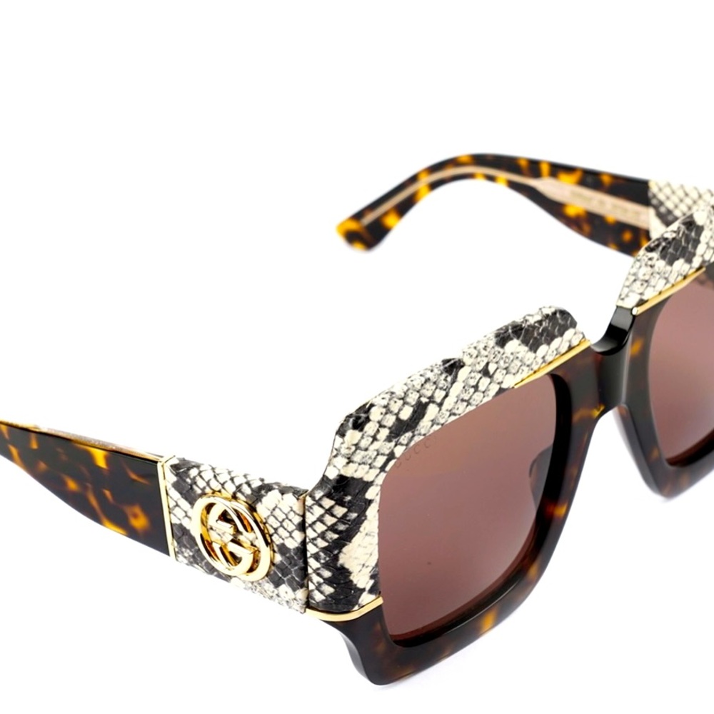 Authentic lightly used GUCCI sunglasses with real snake skin detail.